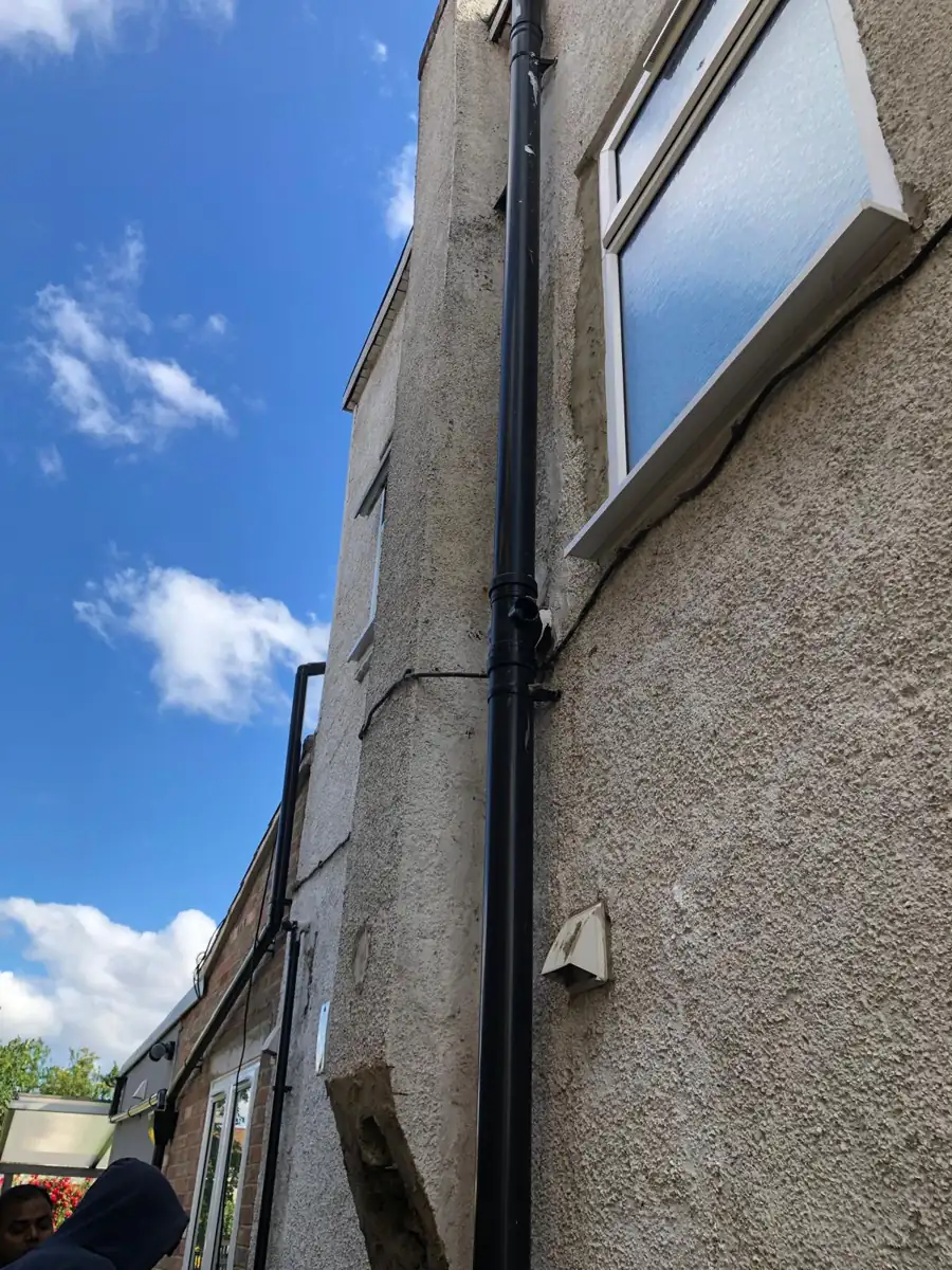 Tired old wall before external wall insulation, North London